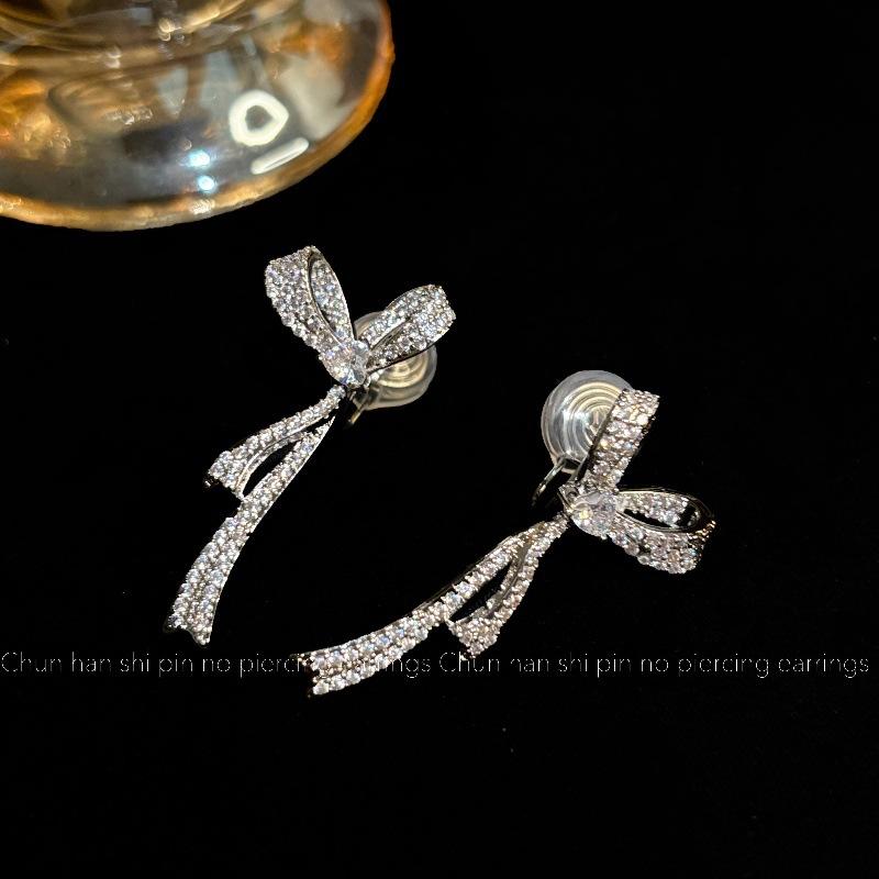 

Thousand gold temperament bow earrings light luxury high-end ear clips mosquito coil disc super flash diamond-set niche design earrings