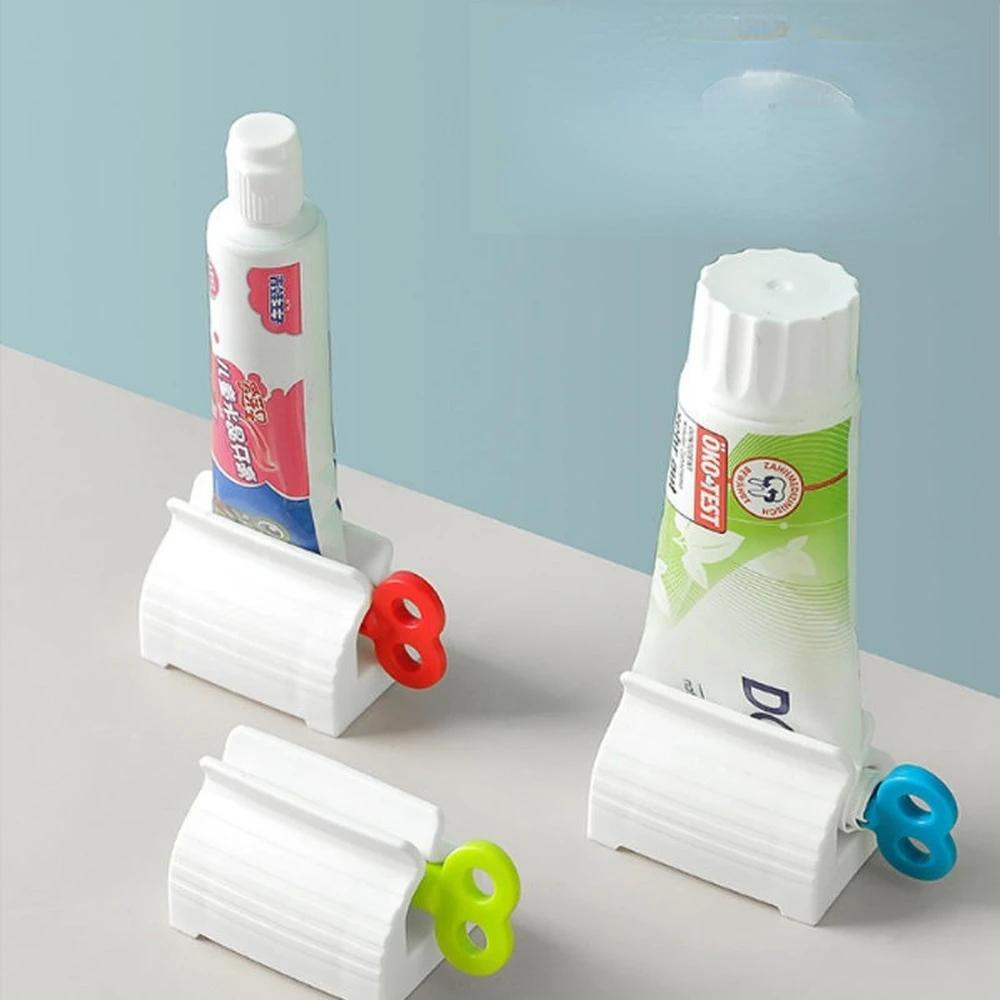 

2pcs Toothpaste Seat Holder Stand Rolling Tube Toothpaste Squeezer Facial Cleanser Dispenser Press for Bathroom Accessories красный