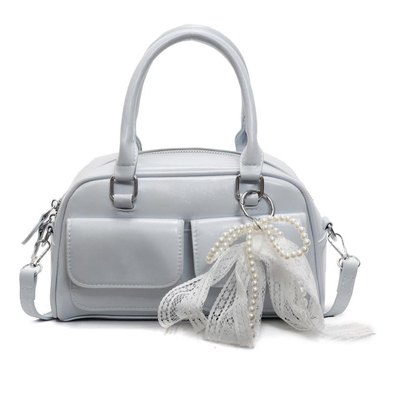 Korean version of the popular spring and summer dopamine simple portable Boston bag niche casual foreign style commuter messenger bag bag woman