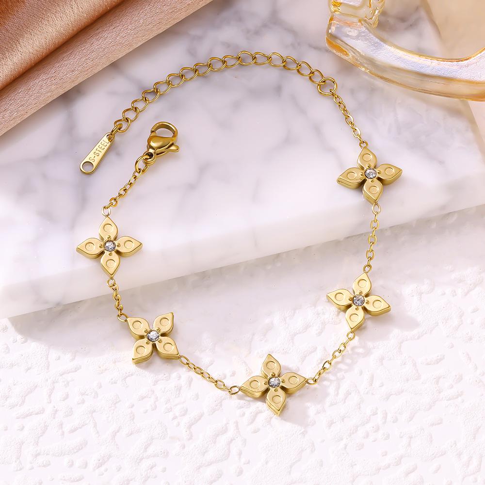 Elegant Four-Leaf Clover Titanium Bracelet with Micro-Paved Diamonds - Light Luxury Women's Floral Jewelry