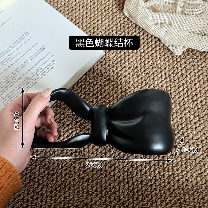 

Вітер Форма банта Керамічна чашка Дизайн Сенс Кольорова глазур Подарунок для дівчат Висока цінність Чашка для пари 350ML