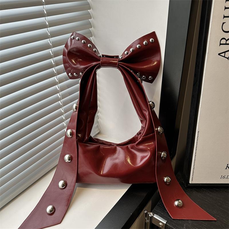 

Beautiful bow hand bag new fashion personality rivet spice girl sweet portable shoulder armpit bag woman