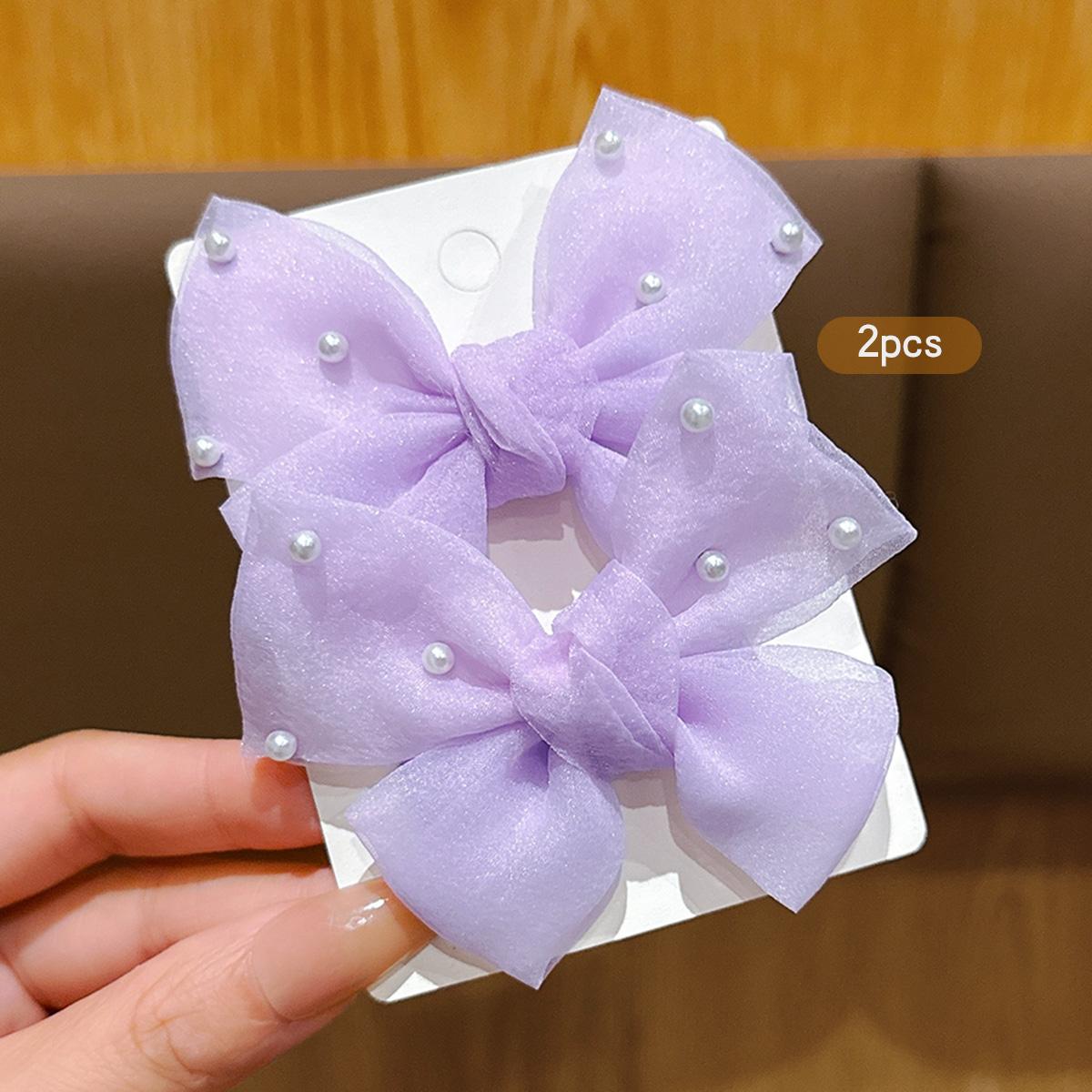 

2 cute purple bow hair clips and hair accessories suitable for daily use