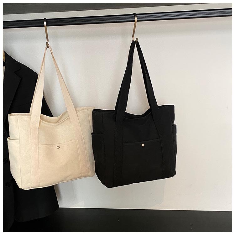 Versatile Literary Canvas Tote: Large Capacity Shoulder Bag for Work & Commute