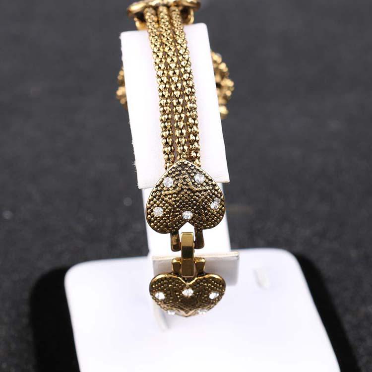 Vintage Blumenarmband mit vergoldeter Schlangenkette und Harz-Strasssteinen