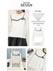 Elegant Women's Knit Top with White Lace Collar and Floral Brooch