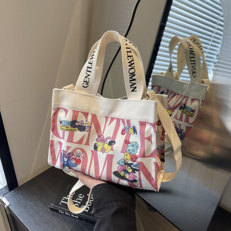Fashion letter canvas small bag women 2025 new casual fashion messenger mobile phone bag going out tote bag simple