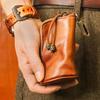 Men's Retro Genuine Leather Waist Key Holder: Large Capacity Cowhide Bucket Bag with Multifunctional Zipper Pouch.