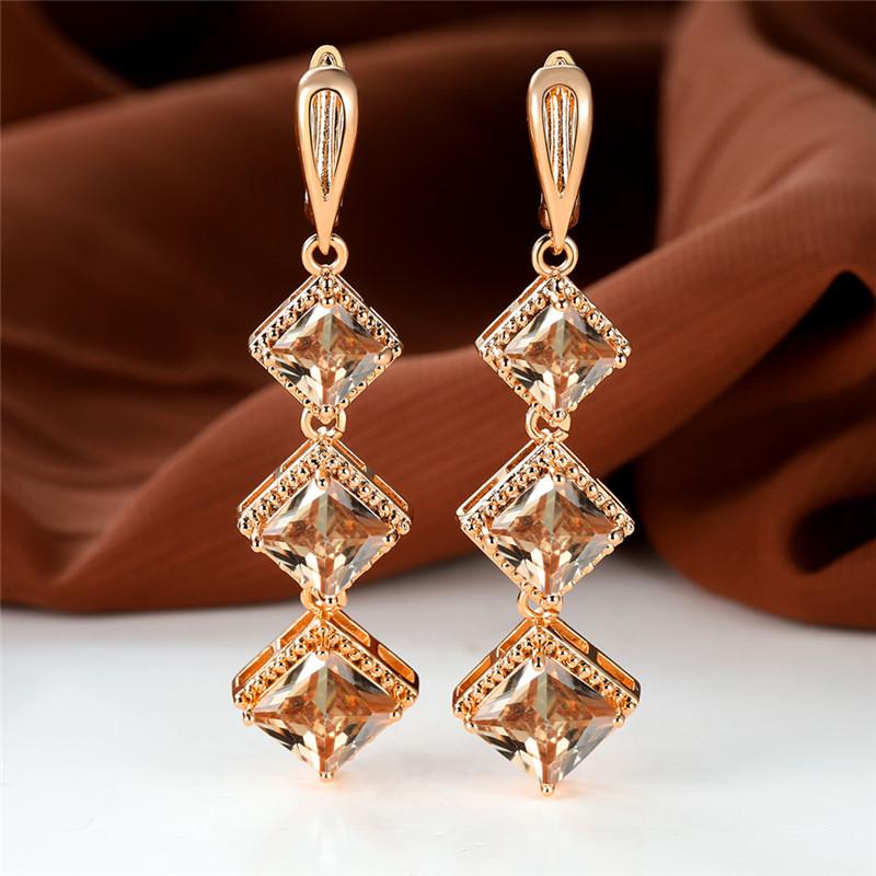 Náušnice s klipom v ružovozlatom prevedení s kamienkami v farbe birthstone, modrý zirkónový kameň, dlhé visacie, svadobné, pre ženy