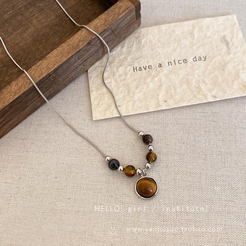 Vintage leather tiger's eye stone pendant necklace women's light luxury niche collarbone chain high-end double-layer stacked sweater chain
