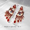 Red Evil Eye Tassel Earrings