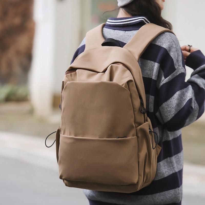 Schoolbag new large-capacity high-value junior high school student casual schoolbag Japanese and Korean version solid color fashionable simple