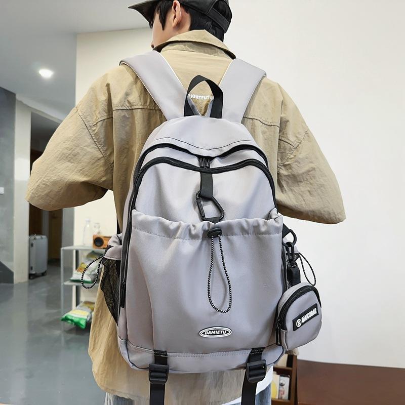 Casual backpack backpack new large-capacity Japanese and Korean boys college students solid color schoolbag