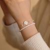 Echtgold-Galvanisierung tropfende Kamelienperle zweiteiliges Set Armband elegantes Armband Nischen-Design Schmuck Damen
