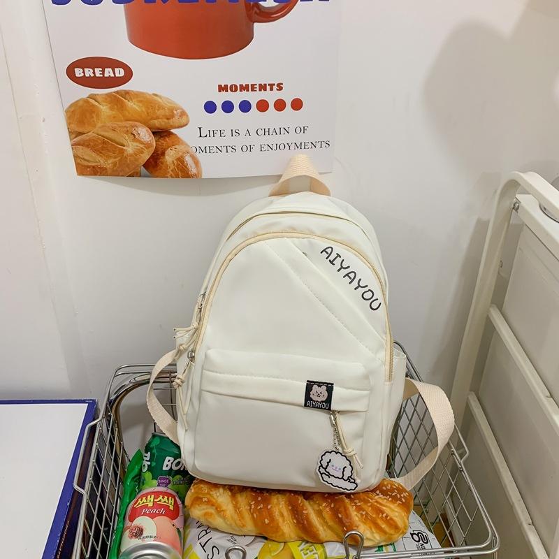 

Шкільний жіночий однотонний рюкзак для учнів середньої школи. Рюкзак великої місткості білий