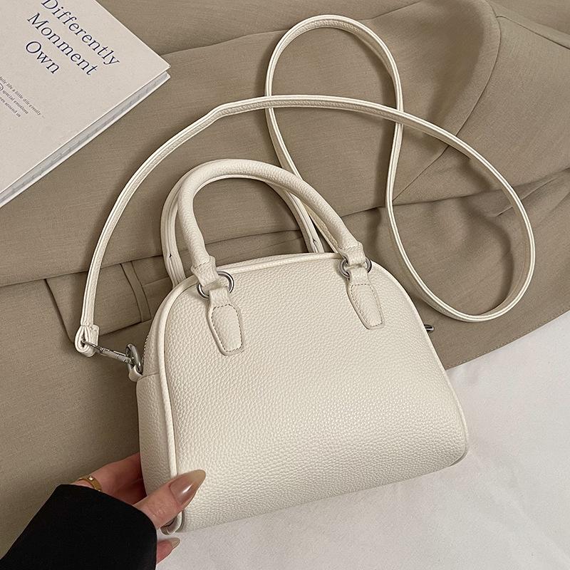 Wholesale new niche simple lychee pattern texture portable Boston bag versatile temperament commuter messenger bag woman