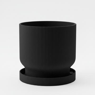 A Modern, Lightweight Black Flowerpot with a Drip Tray, Simple and Functional.