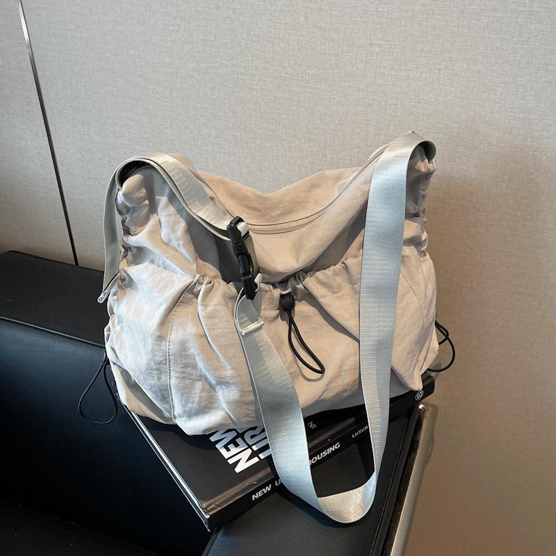 Large Capacity Messenger Bag Canvas Bag Women's New Versatile Niche Single Shoulder High Sense Commuter Dumpling Bag