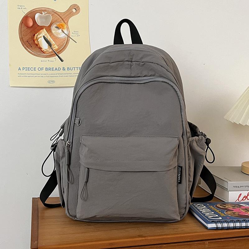 Школьная сумка повседневная простая модная рюкзак мужской и женский большая вместимость водонепроницаемый износостойкий молодежный модный сумка большая вместимость универсальная модель серый
