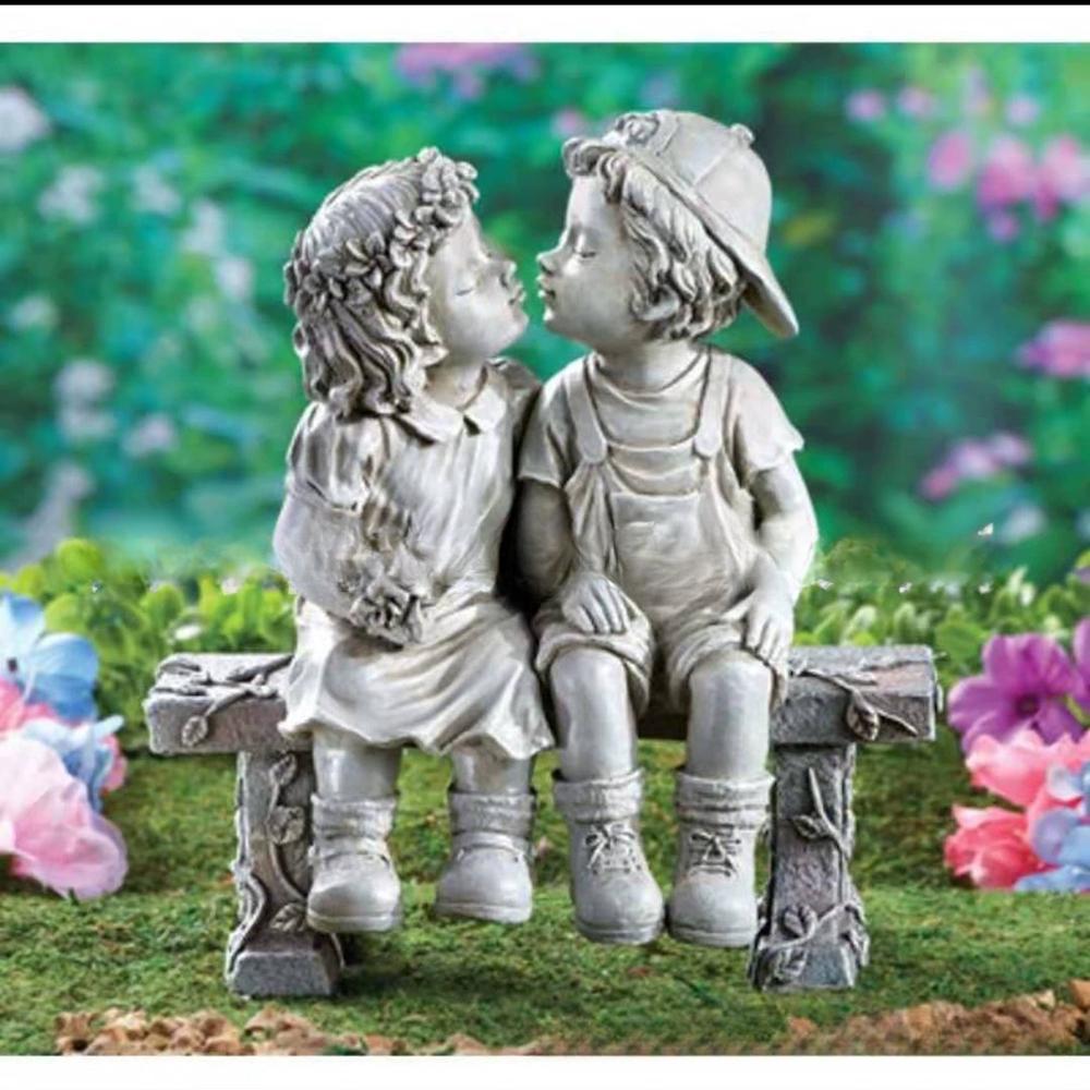Endearing Sculpture: Kids Sharing a Kiss On the Bench