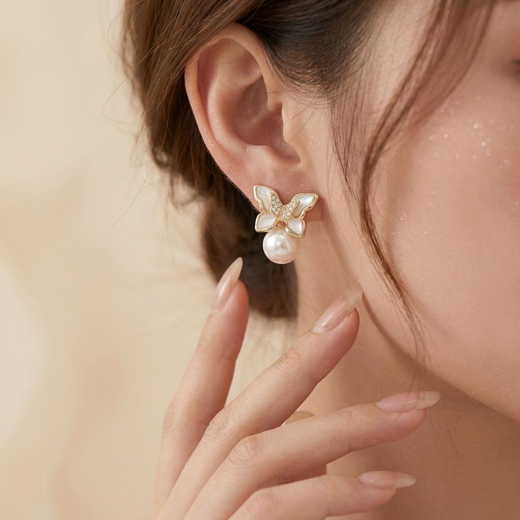 

Gentle style mother-of-pearl butterfly bow earrings for women 9 Silver needle earrings offer a light luxury and sophisticated feel, suitable for 6#