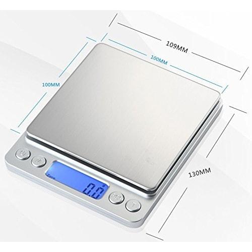 Compact, precision digital scale with 0.1g increments, weighs up to 3kg, includes Japanese instruction manual and two weighing trays