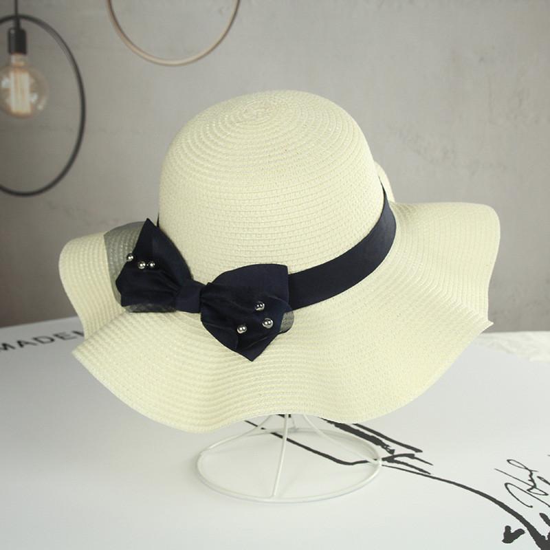 

Ladies Beaded Bow Ribbon Wave Edge Korean Style Straw Sun Hat For Summer Beach білий