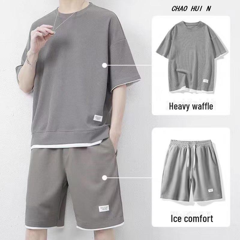 

Чоловічий повсякденний костюм з двох частин вафельного принтування - футболка з коротким рукавом кольору льодового шовку M сірий колір