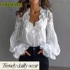 Blusas y camisas de manga larga con cuello en V y estampado de color sólido informal a la moda para mujer