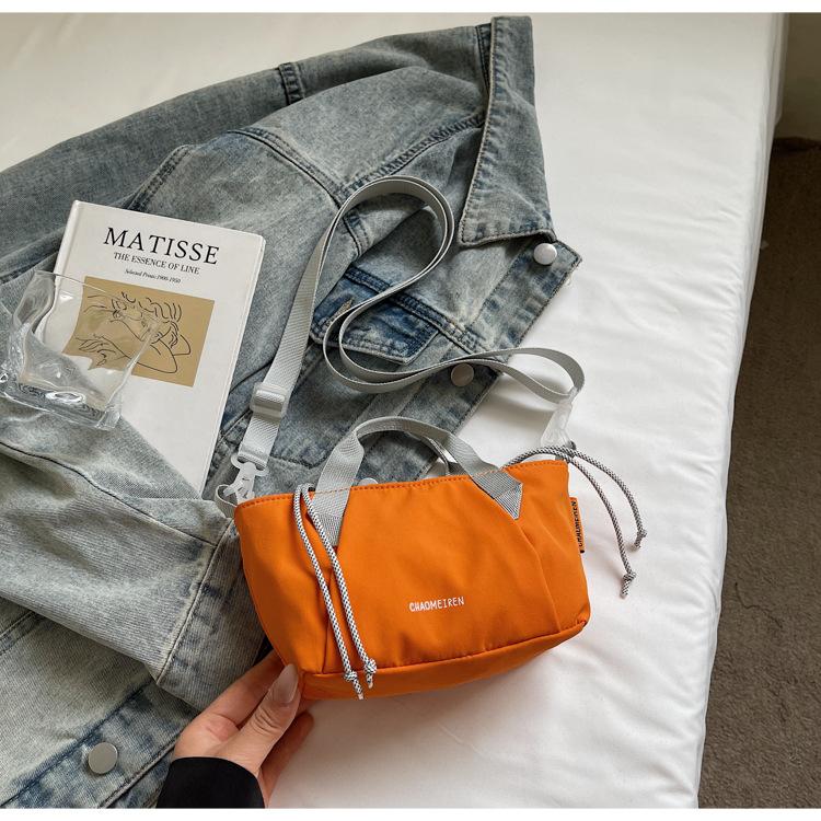 

2025 summer new bucket pumping belt bag women s niche design contrasting color splicing lazy wind messenger commuter backpack оранжевый