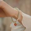 Brățară Guofeng cu perle imitație jad împletite, design de nișă high-end, pandantiv piersică, lux discret, brățară cadou pentru prietenă.