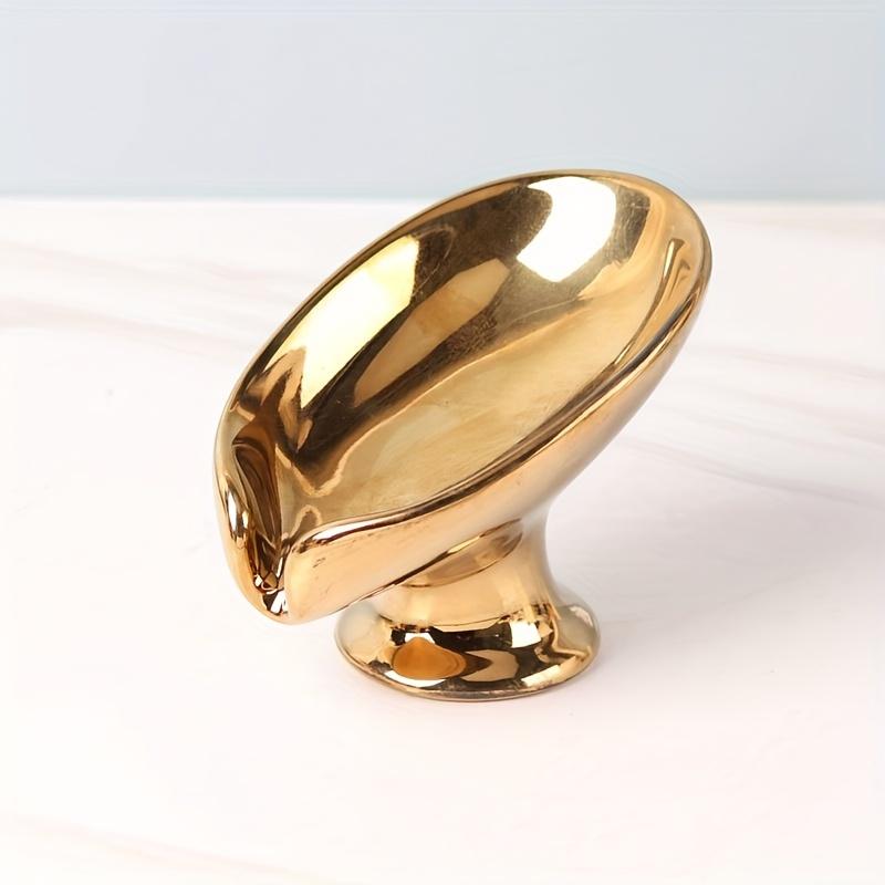 

Elegant Golden and Silver Leaf Ceramic Soap Dish , Oval Self Draining Design for Bathroom Organization, Leaf-Shaped Storage Rack with Textured Surface