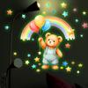 A Cartoon Bear Holding Balloons and A Rainbow-shaped Night Light Sticker for Wall Decoration in The Bedroom.