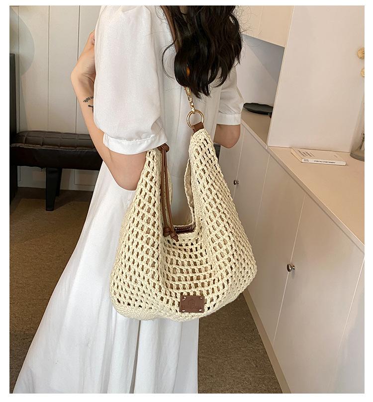 Woven hollow bag women's 2025 new spring and summer seaside vacation travel tote bag beach bag shoulder armpit bag