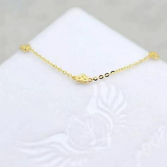 Japanese S925 Sterling Silver Heart-Shaped Bracelet with 14k Gold Plating, Featuring Three Small Cold Style Hearts. Simple and Elegant Design.