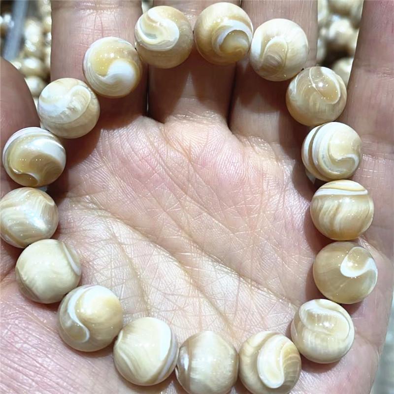 Natural gold and silver silk shell moonlight snail bracelet, Tai Chi pattern cat's eye effect, white disc shell batch, jade mother of pearl bracelet