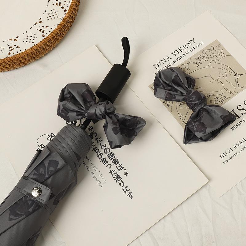 Women's Bow Sun & Rain Dual-Use Automatic Folding Umbrella - Compact, Fresh Sunshade with Black Glue for Sunscreen Protection.