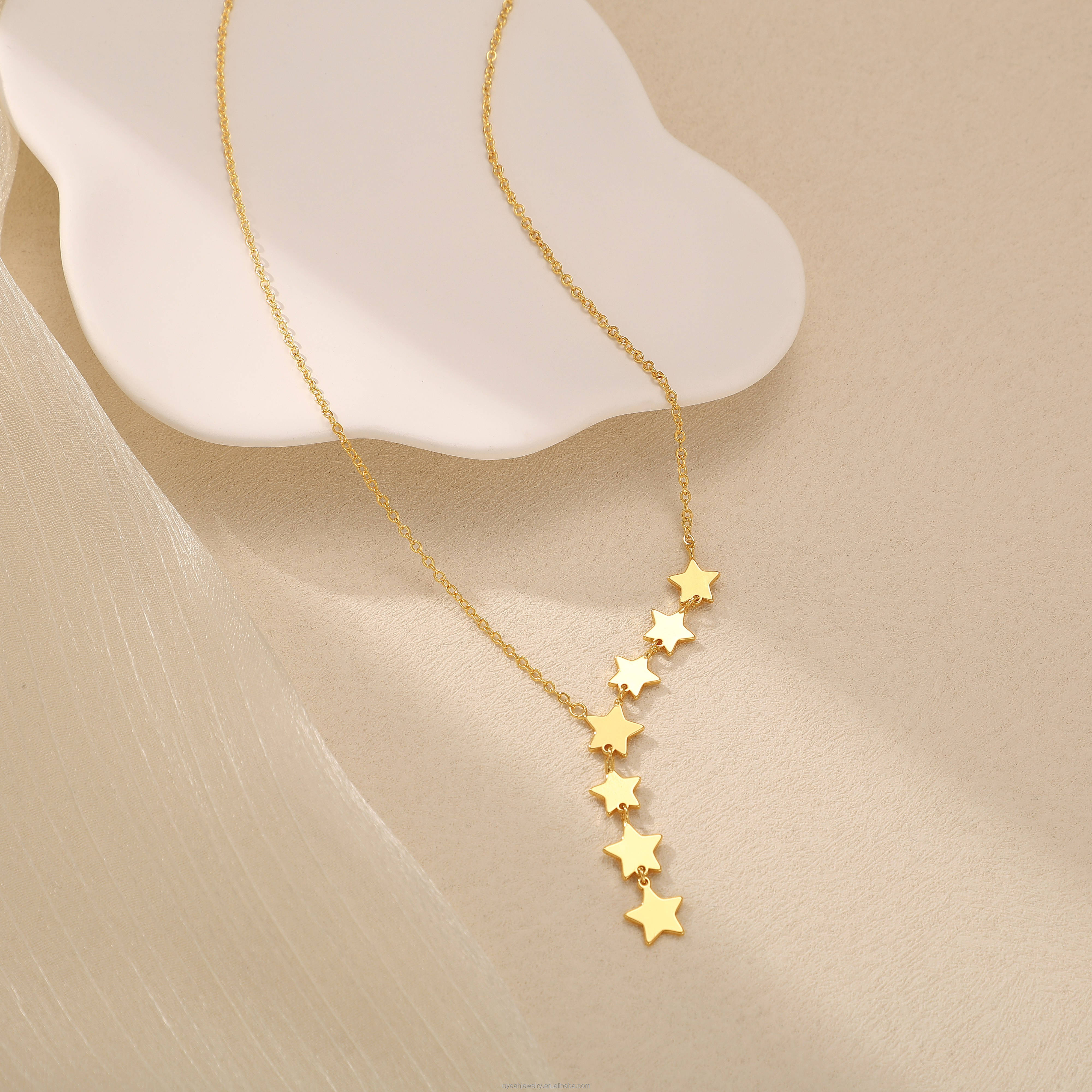 

This single-piece gold minimalist long necklace features star-shaped and Y-shaped tassels, making it a versatile accessory suita Gold&Other
