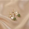 Gentle and elegant natural Hetian jade flower earrings women's handmade winding pearl stud earrings S925 silver needle niche temperament