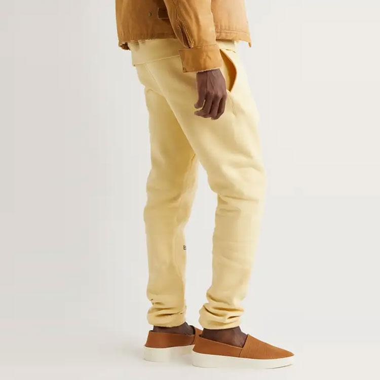 Fear Of God Essentials Fleece Straight-Leg Logo-Print Cotton-Blend Jersey Sweatpants Unisex Sweatpants Cream FOG-SS22-003
