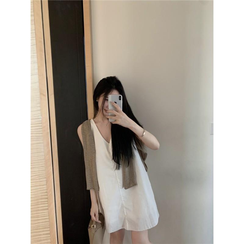 Women's Stylish V-Neck Sleeveless Summer Dress: Loose Fit, Slimming, Solid Color, Short Skirt - New Fashion Collection.