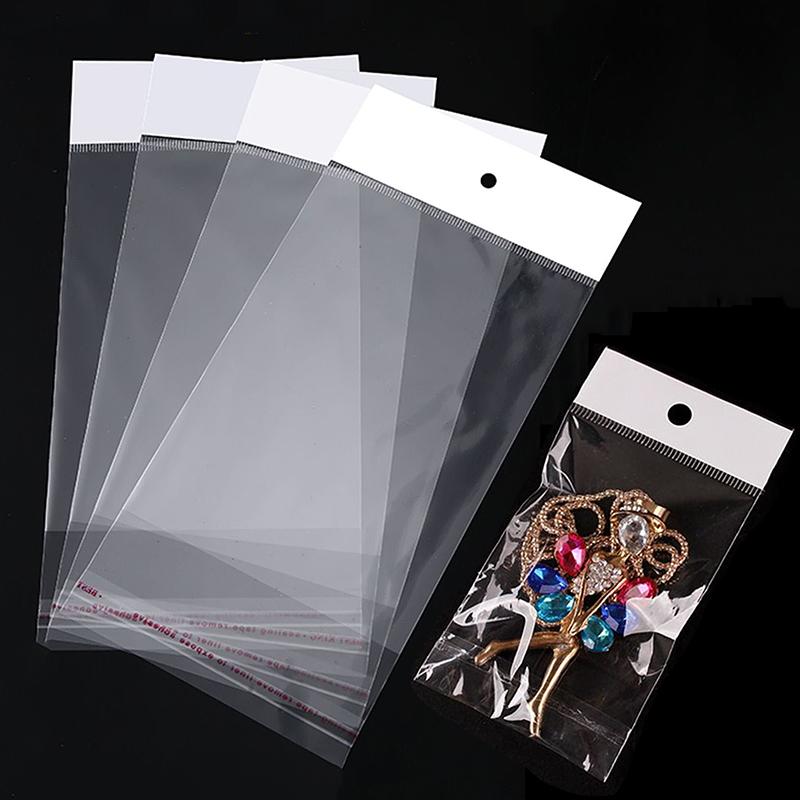 100 pièces Sac d'emballage transparent auto-adhésif Poches Opp en plastique à suspendre Sacs d'étanchéité Cadeaux pour présentation de bijoux Emballage de vente au détail