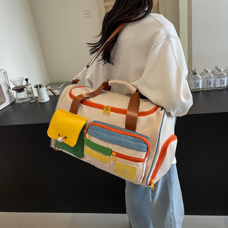 Contrasting color messenger sports fitness bag large-capacity travel hand luggage bag fashion going out short business trip travel bag