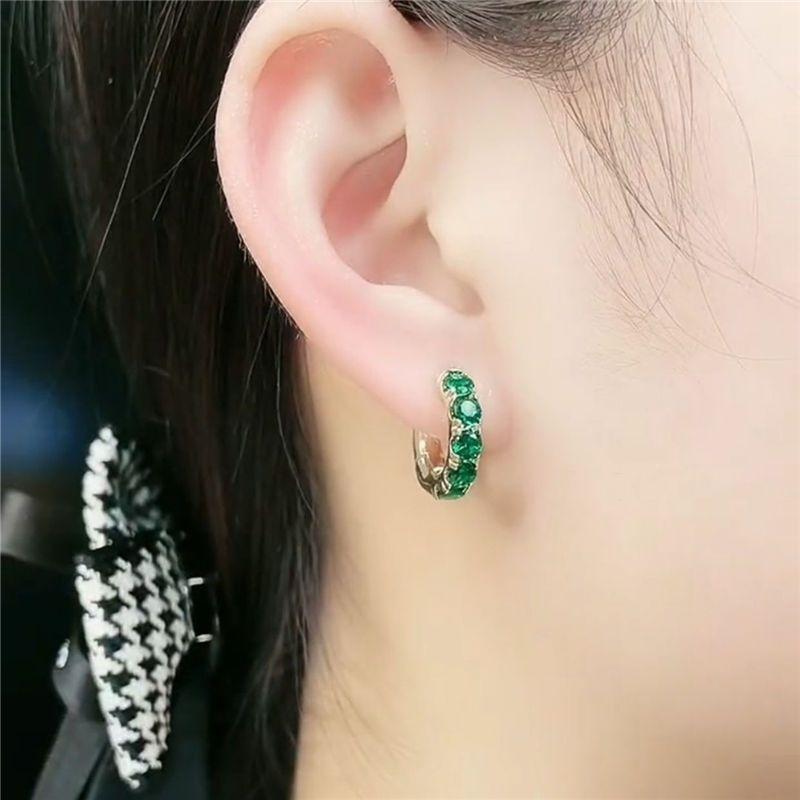 Retro Hong Kong style emerald earrings temperament design sense high-grade green ring ear buckle new light luxury zircon