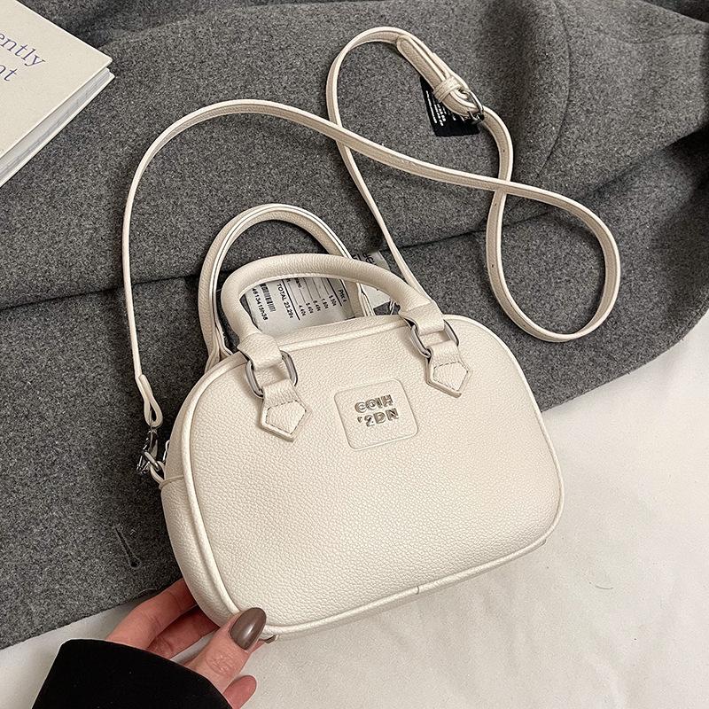 Early Spring Hot Sale French Niche Fashionable Portable Bowling Bag Solid Color Versatile Temperament Advanced Sense Messenger Women's Bag