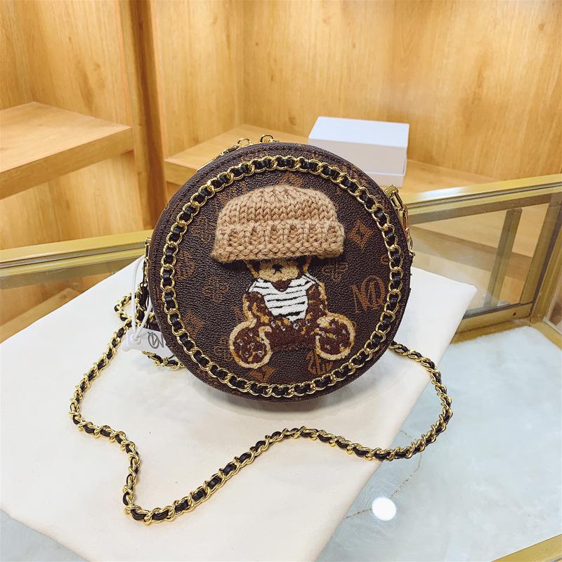 

Woven chain small round bag women s 2025 new retro printed shoulder messenger bag small golden ball bear bag темно-коричневого
