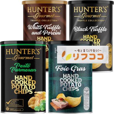 Kartoffelchips-Dosen-Sortiment mit 4 Sorten: Gras-, Basilikum-Parmesan-, Schwarzer Trüffel- und Weißer Trüffel-Steinpilz-Geschmack. 1 von 4 Dosen.