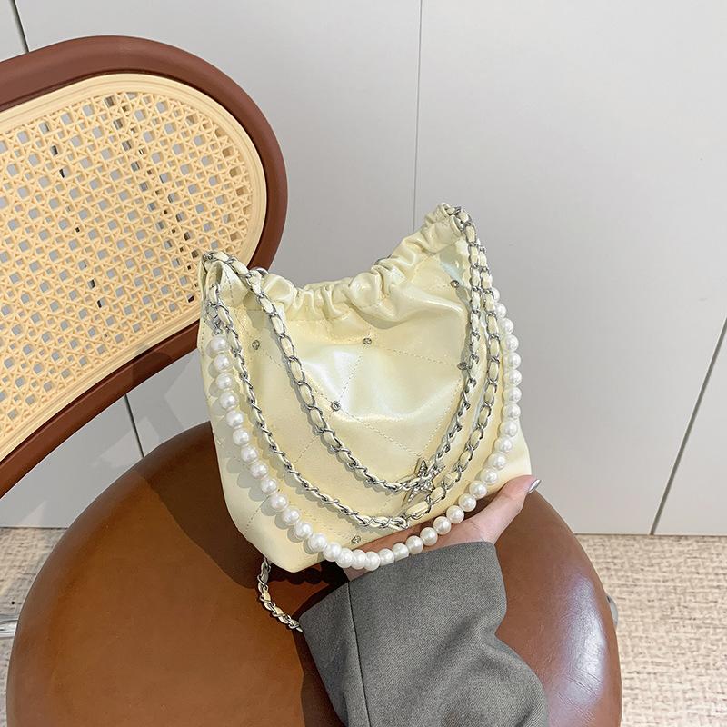 

Large-capacity bags, women s new models are popular today, summer versatile chain shoulder bags, beaded bucket bags. жовтий