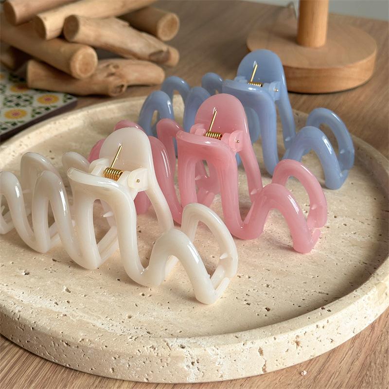 Fluid Wave Silhouette Hair Clip In Dreamy Translucent Hues Provides Secure Hold For Messy Buns And Modern Minimalist Updos