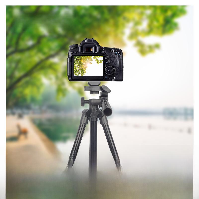 Black Mobile Phone Live Broadcast Tripod with 1.1m Height, Fishing Light Telescope, and Aluminum Alloy Build.